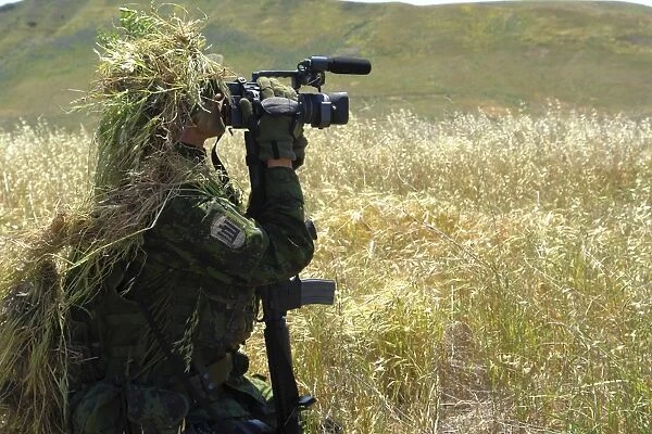 A combat videographer practices evasion techniques
