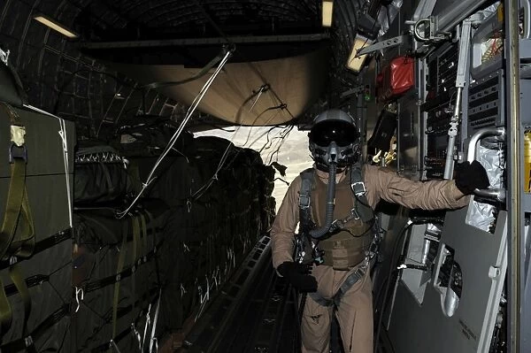 Container Delivery System bundles exit a C-17 Globemaster during an airdrop mission