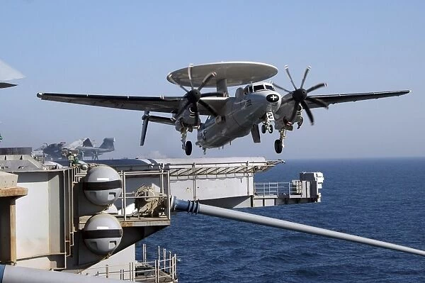 An E-2C Hawkeye launches off the flight deck of USS Nimitz