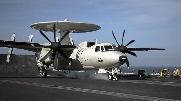 An E-2C Hawkeye prepares to launch from the flight deck of USS Nimitz