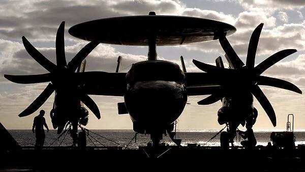 An E-2C Hawkeye secured to the flight deck of USS Harry S. Truman