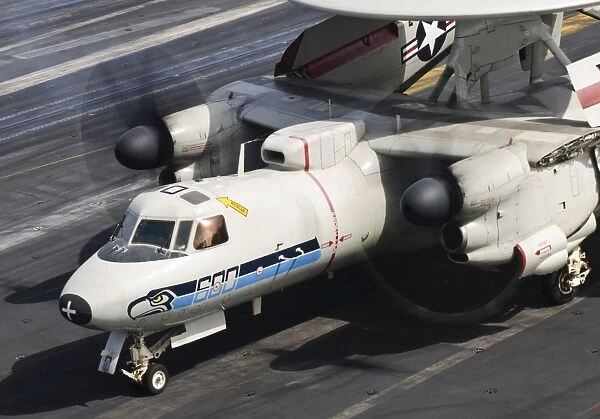 An E-2C Hawkeye sits ready aboard USS Harry S. Truman