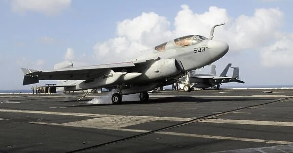 An E  /  A-6B Prowler makes an arrested landing aboard USS Carl Vinson