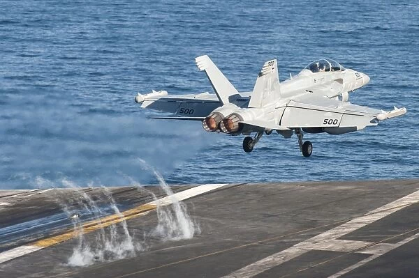An EA-18G Growler launches from the flight deck of USS Harry S. Truman