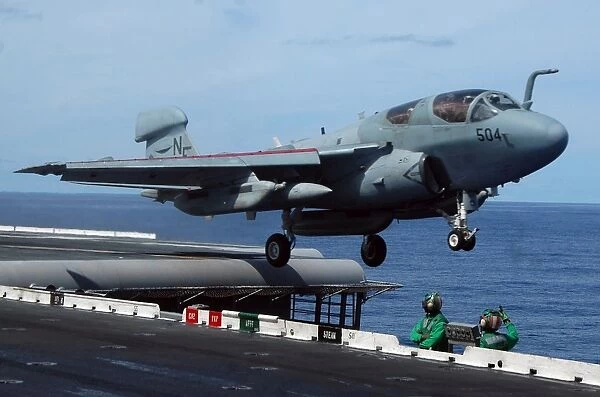 An EA-6B Prowler launches off the flight deck of USS Kitty Hawk