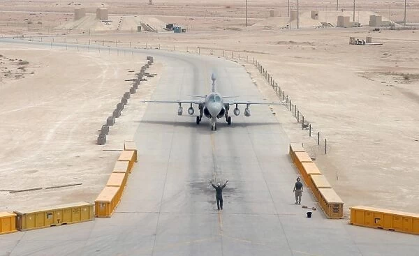 An EA-6B Prowler taxis to the hangar