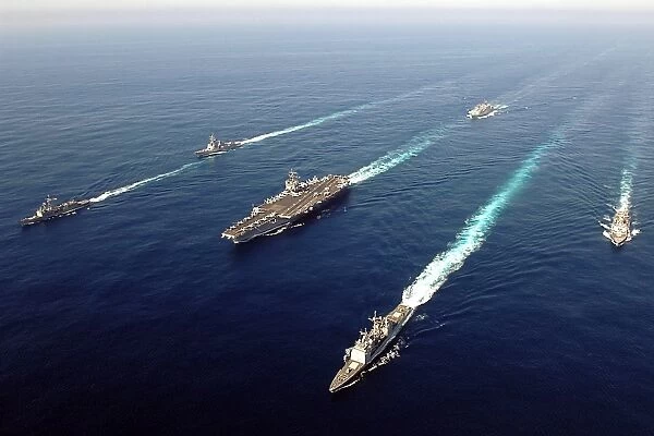 The Enterprise Carrier Strike group sails through the Atlantic Ocean in formation