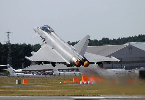 Eurofighter EF2000 Typhoon from the Royal Air Force at full afterburner during takeoff