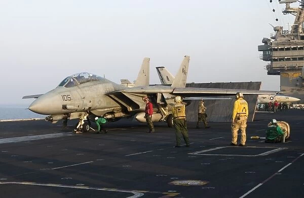 An F-14D Tomcat in launch position on the flight deck of USS Theodore Roosevelt