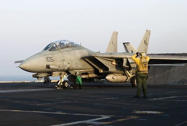 An F-14D Tomcat in launch position on the flight deck of USS Theodore Roosevelt