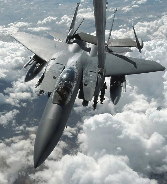 An F-15 E Strike Eagle receives fuel from a KC-10 Extender