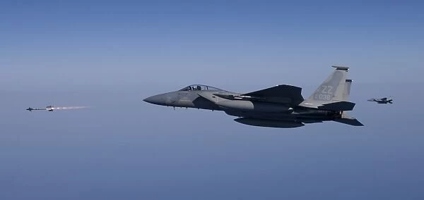 An F-15 Eagle fires an AIM-9 missile