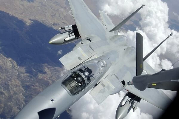An F-15 Eagle pulls away from a KC-135 Stratotanker after refueling