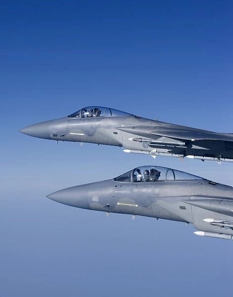 Two F-15 Eagles fly over New England during a training mission