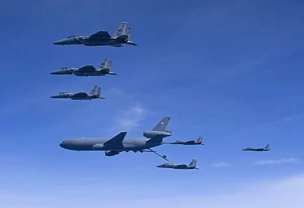 Six F-15 Eagles refuel from a KC-10 Extender