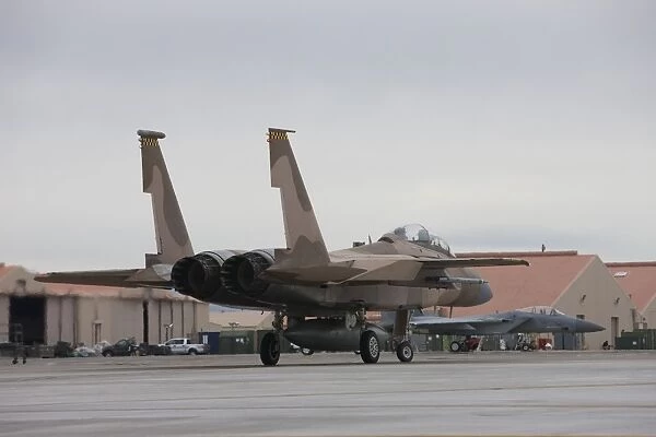 An F-15C Eagle taxis to the runway at Nellis Air Force Base, Nevada