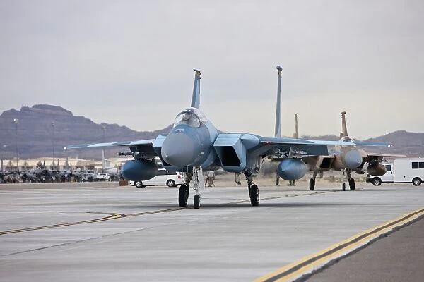 F-15C Eagles taxi to the runway at Nellis Air Force Base, Nevada