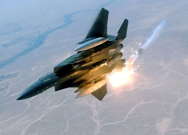 An F-15E Strike Eagle pops flares during a combat sortie