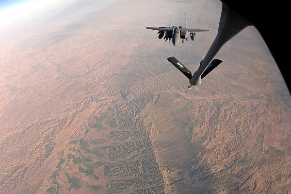 An F-15E Strike Eagle is refueled by a KC-135 Stratotanker