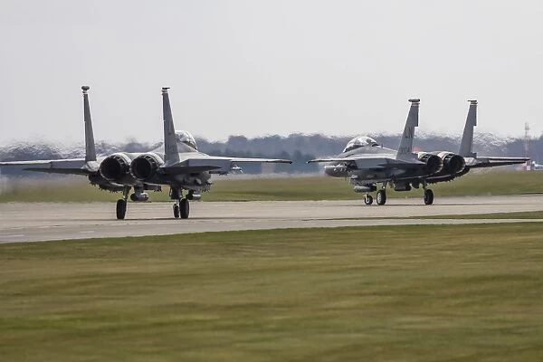 F-15E Strike Eagles of the U. S. Air Force line up for takeoff