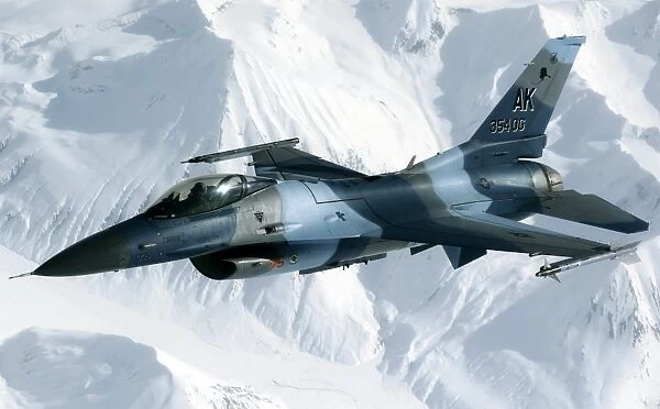 An F-16 Aggressor disconnectsfrom a KC-10 Extender after being refueled