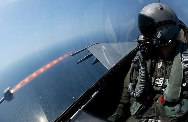 An F-16 Fighting Falcon fires an AIM-9 missile