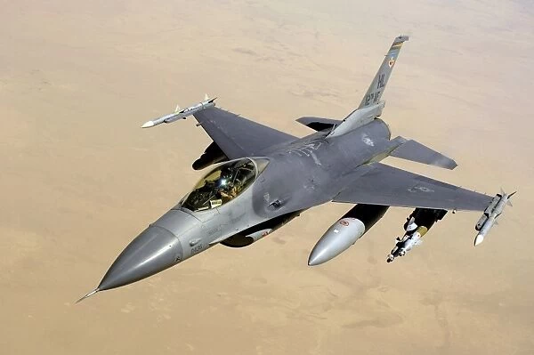 An F-16 Fighting Falcon in flight over Iraq