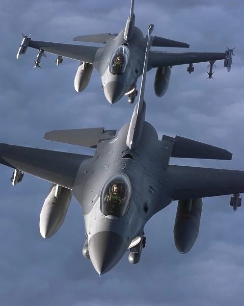 Two F-16 Fighting Falcons fly in formation