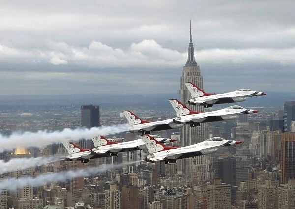 Six F-16 Fighting Falcons with the U. S. Air Force Thunderbirds fly in delta formation