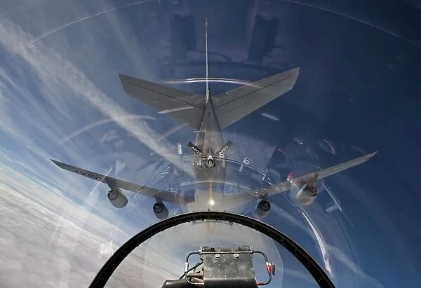 An F-16 flies in the pre-contact position behind a KC-135R Stratotanker