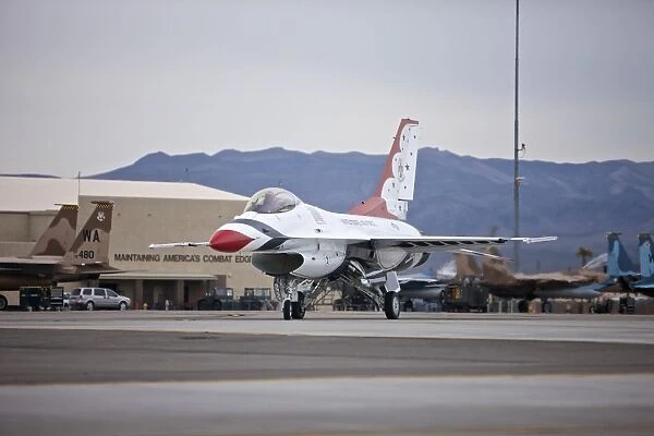 An F-16C Thunderbird taxis to the runway at Nellis Air Force Base, Nevada