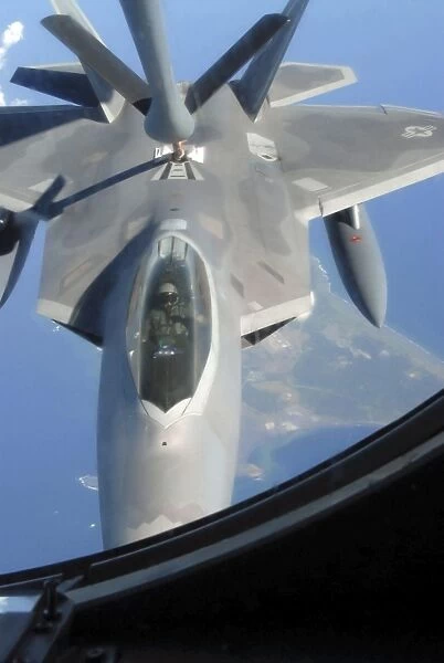 An F-22 Raptor receives fuel from a KC-135 Stratotanker
