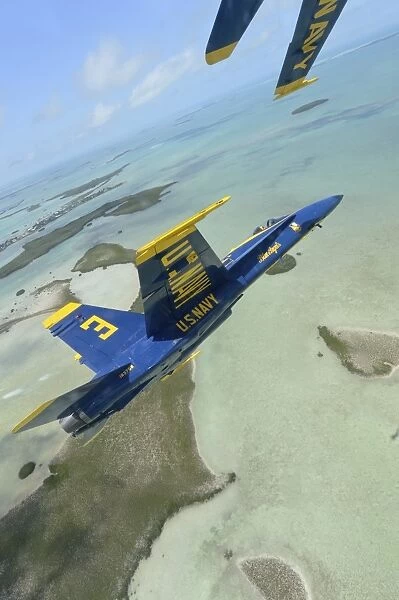 An F  /  A-18 Hornet of the Blue Angels flies over the Florida Keys
