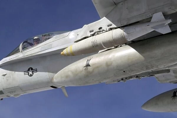 An F  /  A-18C Hornet flies over the Pacific Missile Range Facility