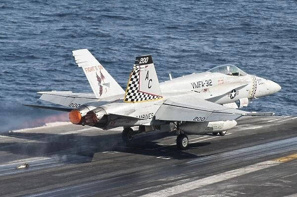 An F  /  A-18C Hornet launches from USS Harry S. Truman