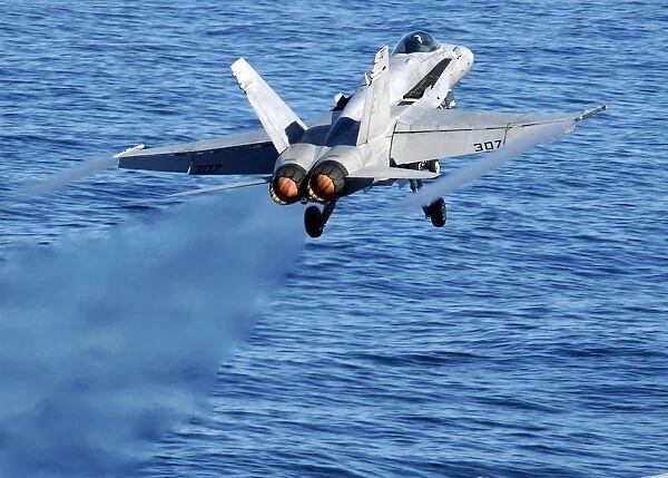 An F  /  A-18C Hornet taking off
