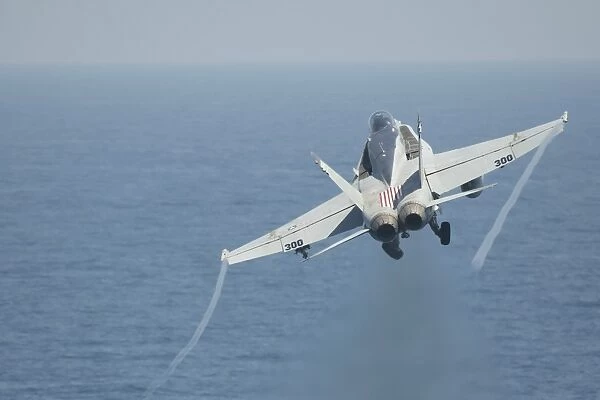 An F  /  A-18C Hornet taking off
