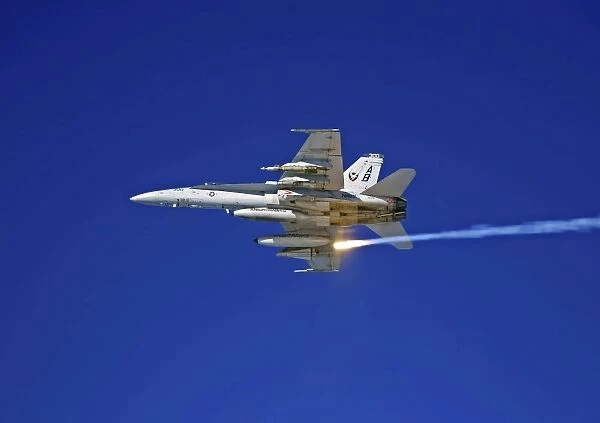 An F  /  A-18C Hornet testing its flare countermeasures system prior to heading into Iraq
