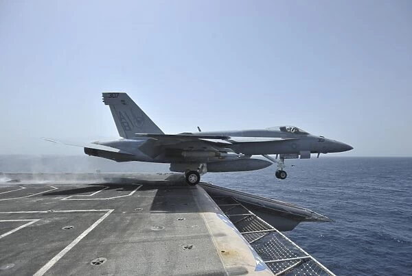 An F  /  A-18E Super Hornet launches from USS Enterprise