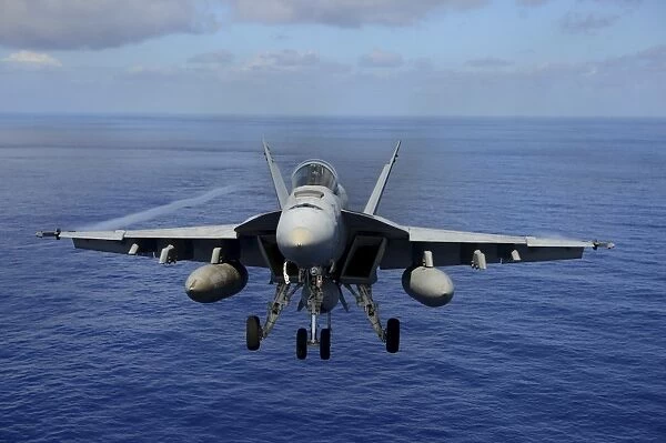 An F  /  A-18E Super Hornet over the Pacific Ocean