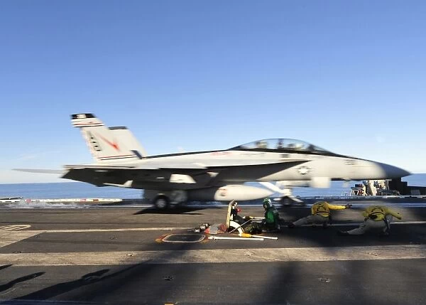 An F  /  A-18F Super Hornet launches from the aircraft carrier USS Enterprise