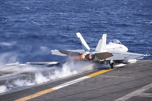 An F  /  A-18F Super Hornet launches from USS Nimitz