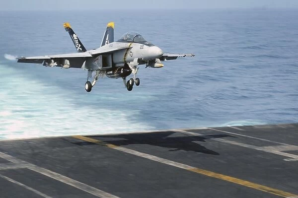 An F  /  A-18F Super Hornet prepares to land on the flight deck USS Dwight D. Eisenhower