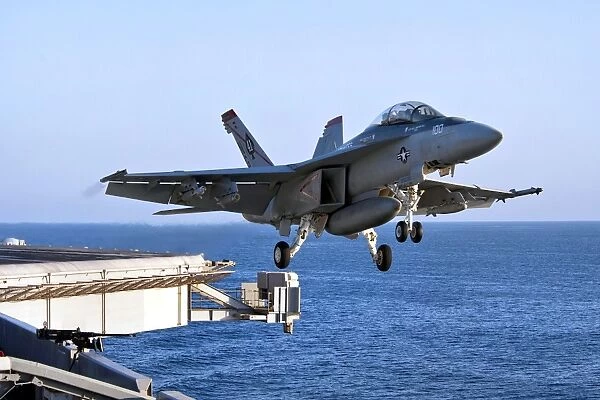An F  /  A-18F Super Hornet takes off from the carrier USS John C. Stennis