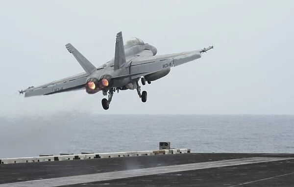 An F  /  A-18F Super Hornet taking off from USS Nimitz