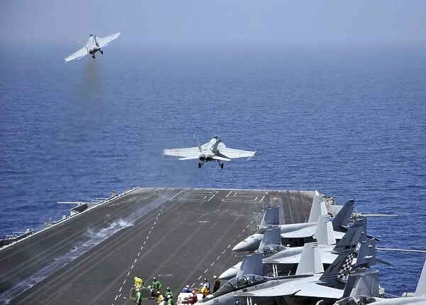 F  /  A-18F Super Hornets launch from the aircraft carrier USS Enterprise