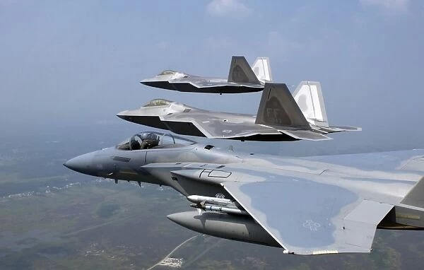 Three F  /  A-22 Raptors fly in formation during a training sortie