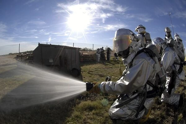 Firefighters participate in a fire training exercise