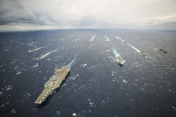 The George Washington Strike Group and Japan Maritime Self-Defense Force ships