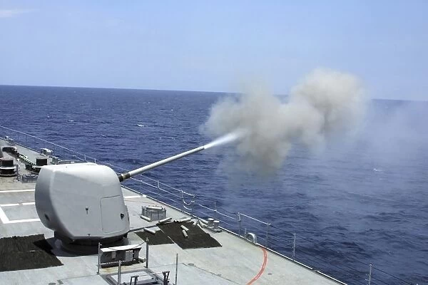 The guided missile destroyer USS Spruance fires its 5 54 gun